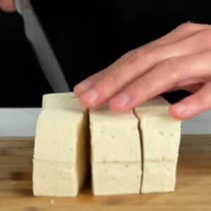 slicing tofu into cubes