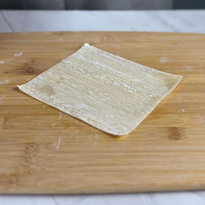 egg roll wrapper on a chopping board