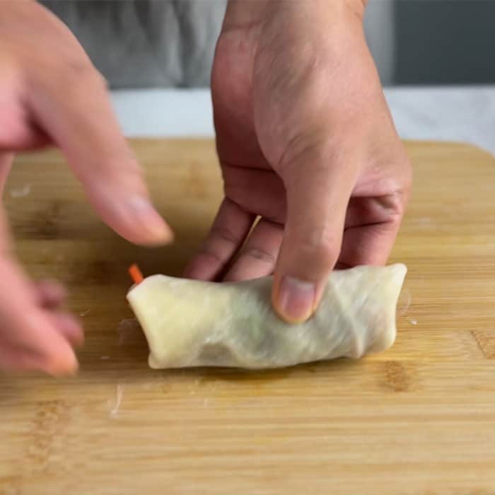 Sealing the wrapped vegetable egg roll