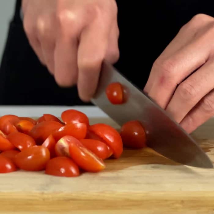 Slicing cherry tomatoes in half