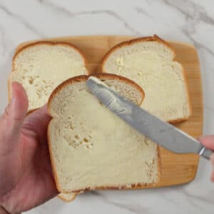 spreading butter to bread