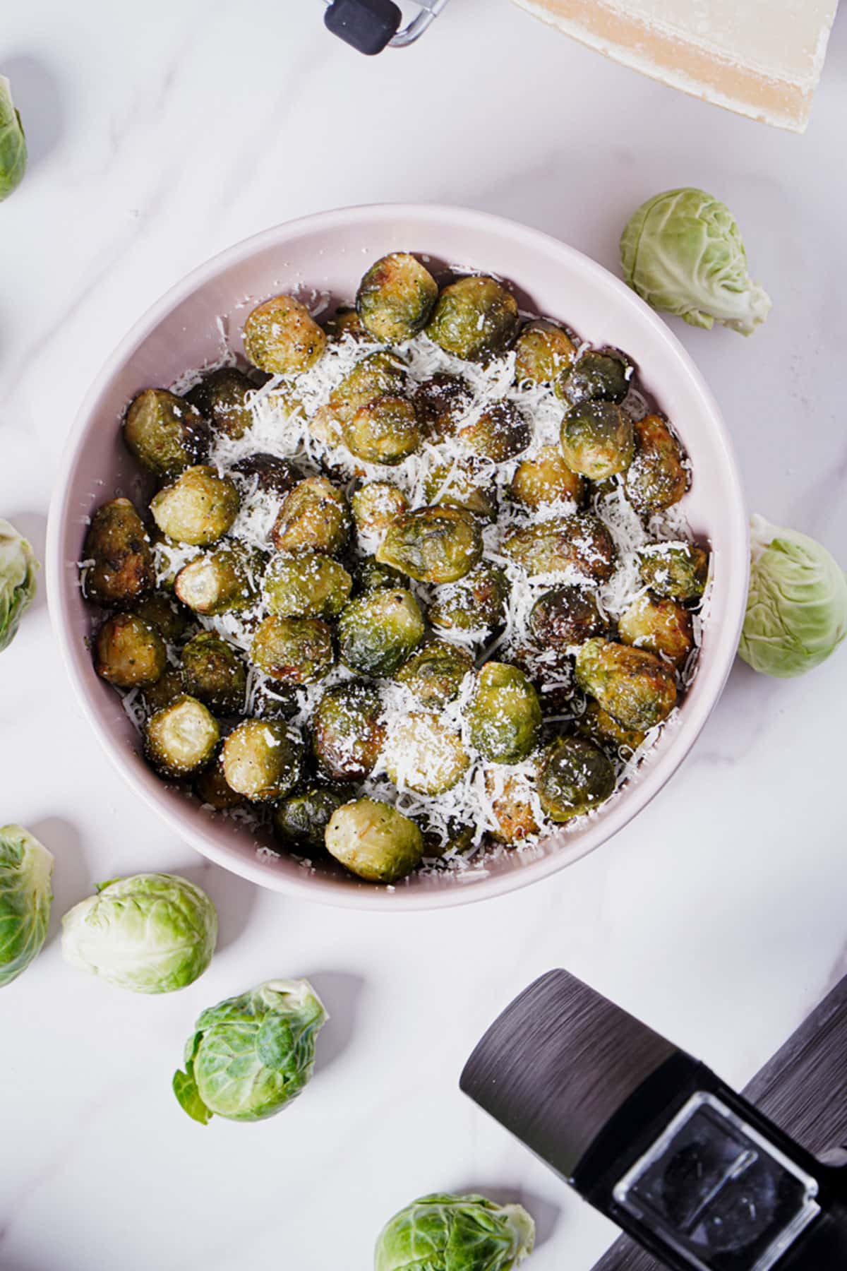 Frozen Brussels sprouts air fryer recipe bite shot, with parmesan cheese.