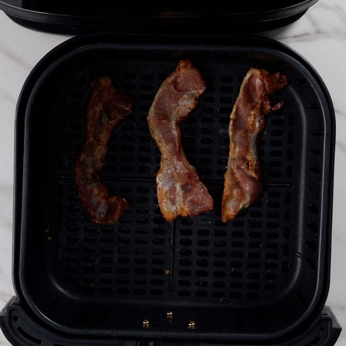 Air frying bacon.