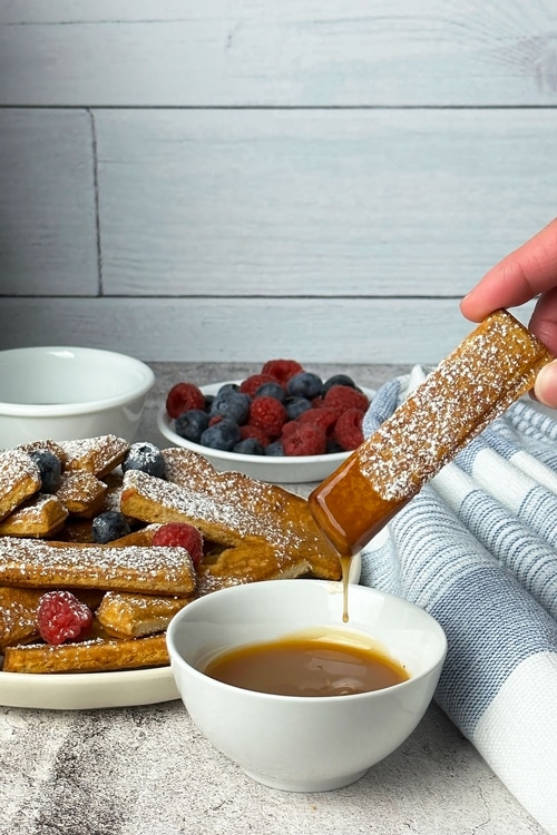 air fryer frozen french toast sticks served with berries and caramel dip