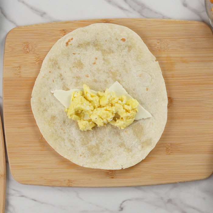 eggs with cheese on tortilla wrap
