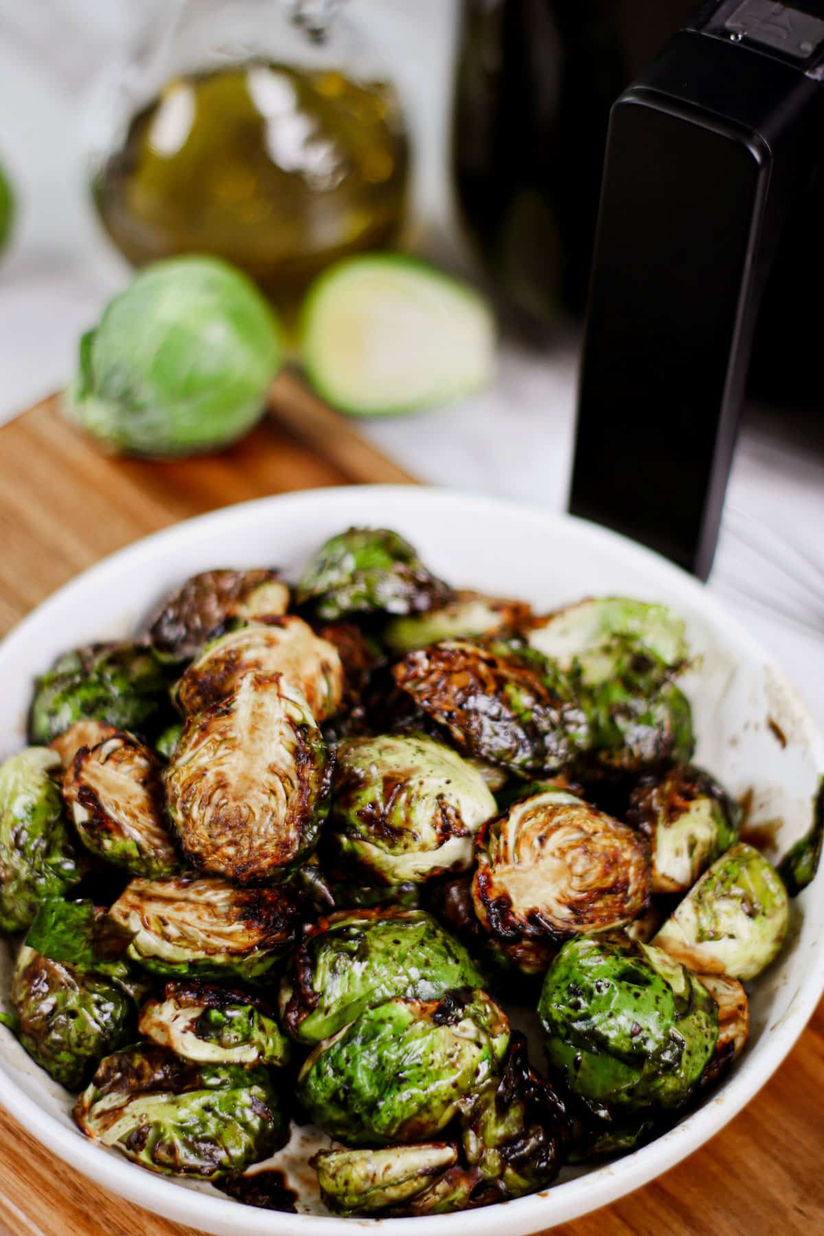 Air fryer brussels sprouts balsamic recipe bite shot, served in a small bowl.