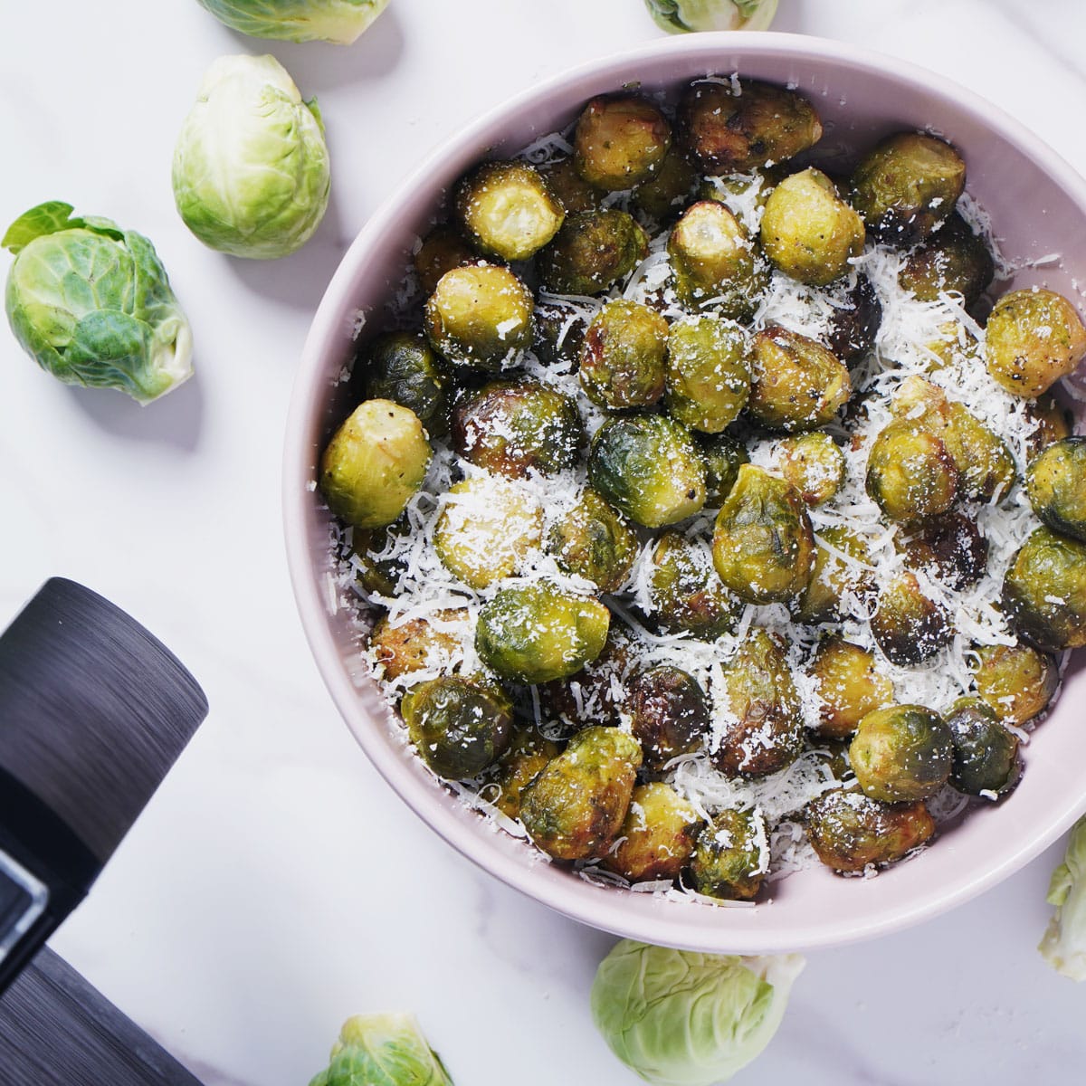 Air fried frozen brussels sprouts in a bowl