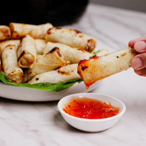 Air fried frozen spring rolls with sweet and spicy dipping sauce