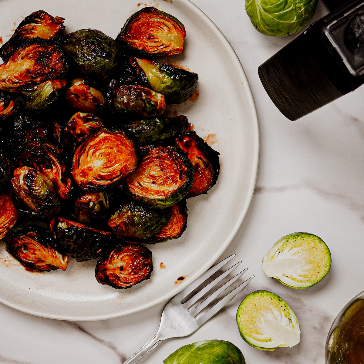 Air fried honey sriracha Brussels sprouts served in a plate