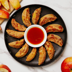 Air fryer apple fries served with caramel dipping sauce