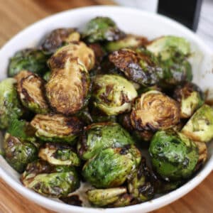 Air Fryer Brussels Sprouts with Balsamic Honey Glaze served in a plate