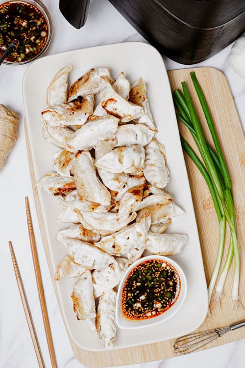 Air Fryer Potstickers served with tasty dipping sauce