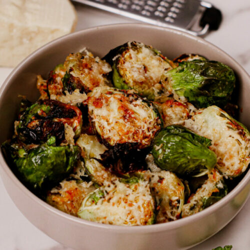 Parmesan Brussels Sprouts Air Fryer recipe served in a grey bowl.