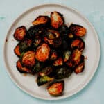 Honey sriracha Brussels sprouts air fryer recipe served in a white plate