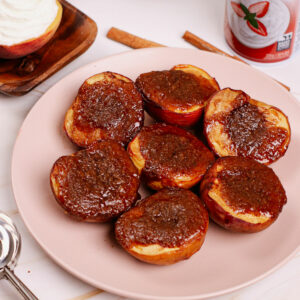 Air fryer grilled peaches, with whipped topping on the side.