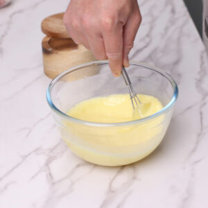 Step 3: Beating eggs in a large bowl.