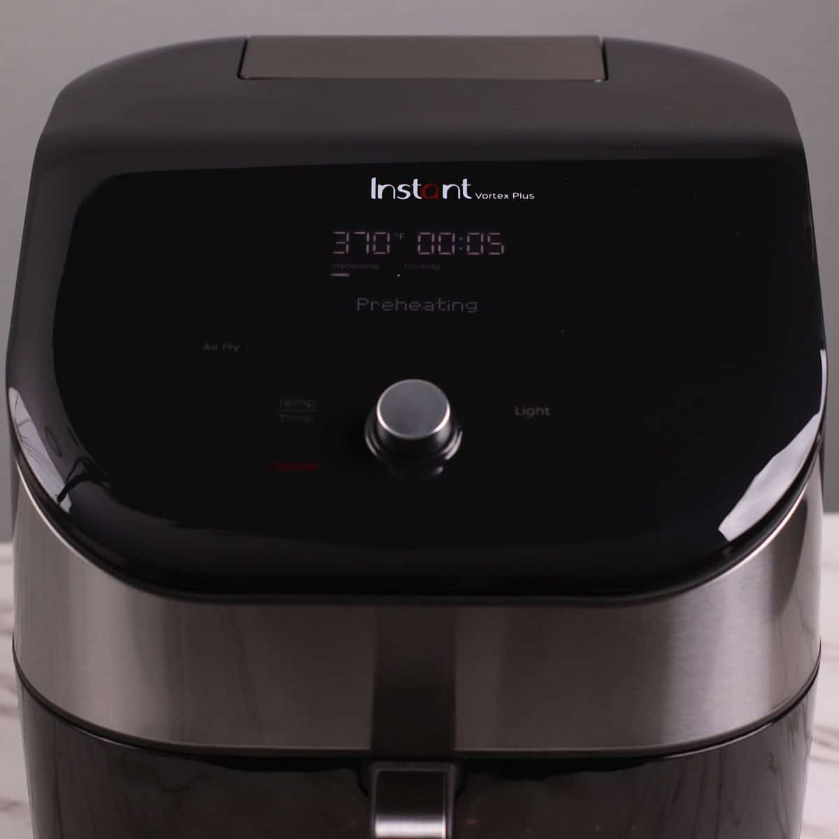 Preating Instant Pot Vortex Plus Air Fryer to 370°F (187°C).