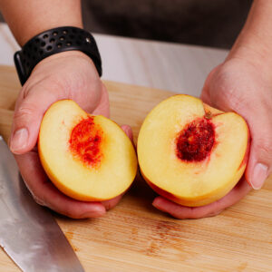 Sliced peach with pit