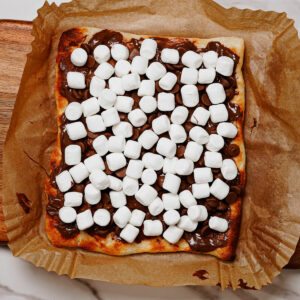 Fully assembled s'mores dessert pizza.