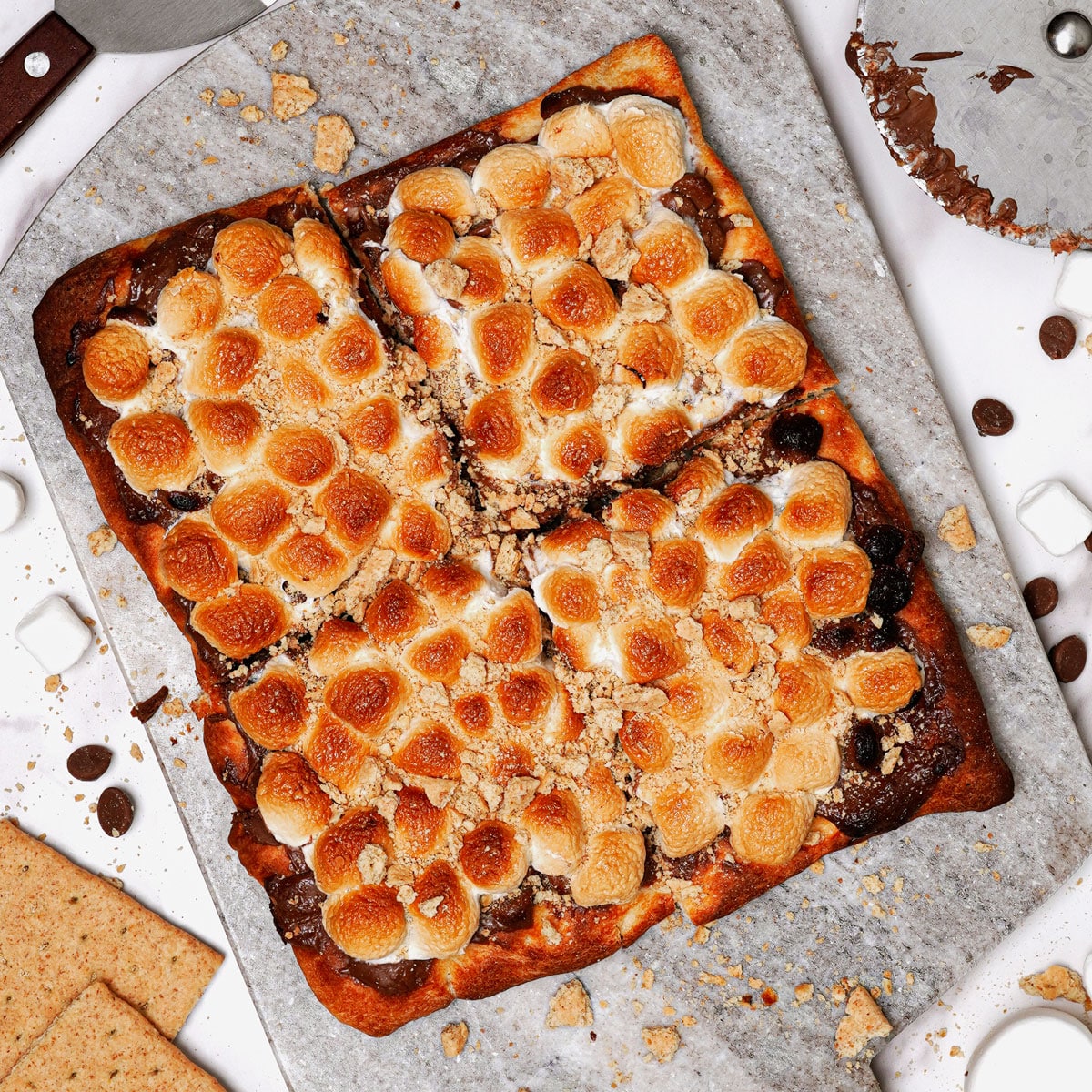 Air fryer s'mores pizza on a marble serving board.