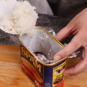 Step 3: Adding the sushi rice to the mold