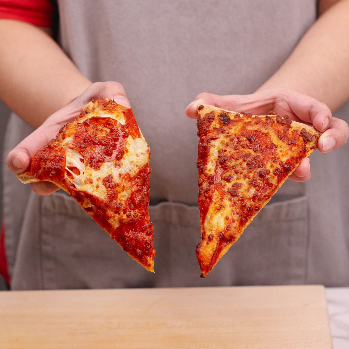 Air fried vs microwaved pizza slice, side by side comparison