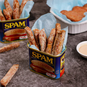 Air fryer spam fries served in a can of spam with fry dipping sauce on the side.