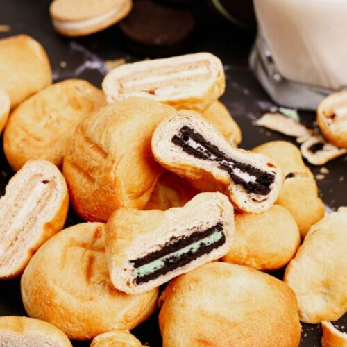 Stacked dough-wrapped air fried oreos with assorted flavors.