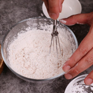 Mixing dry batter in a small bowl