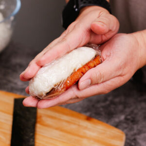 Step 5: Shaping the sushi rice to match the Spam slice