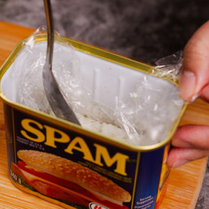 Step 4: Pressing rice onto the Spam