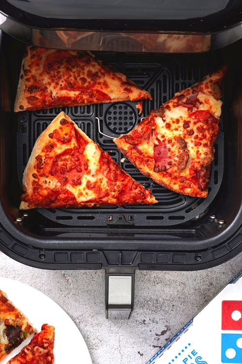 How to reheat pizza in the air fryer bite shot, 3 slices of regular and thick-crust pizza