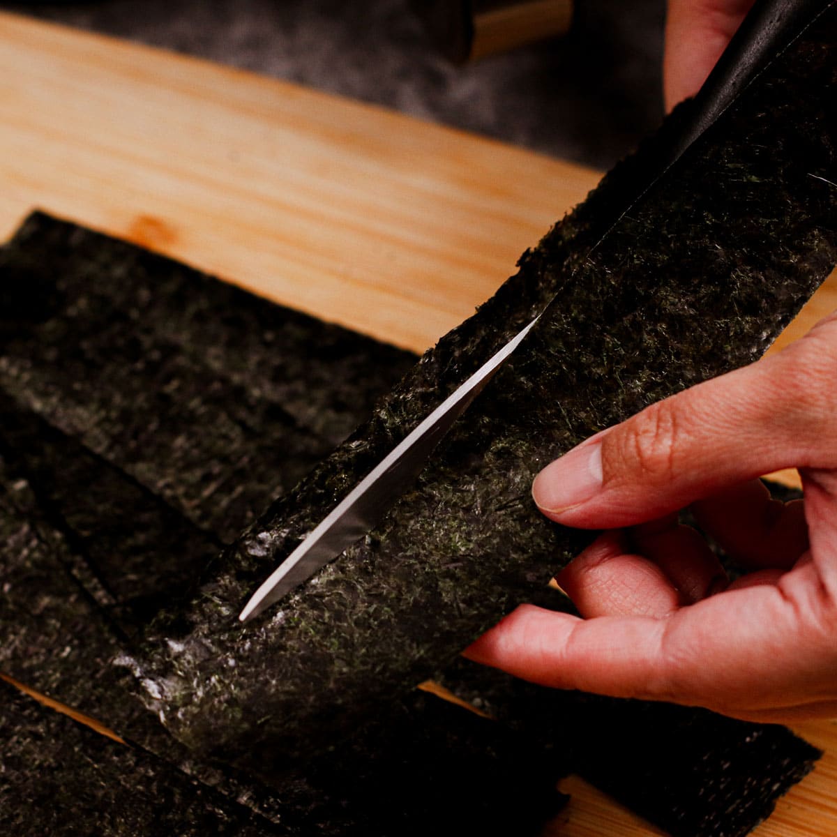 Cutting nori sheets in to 1-inch-wide strips