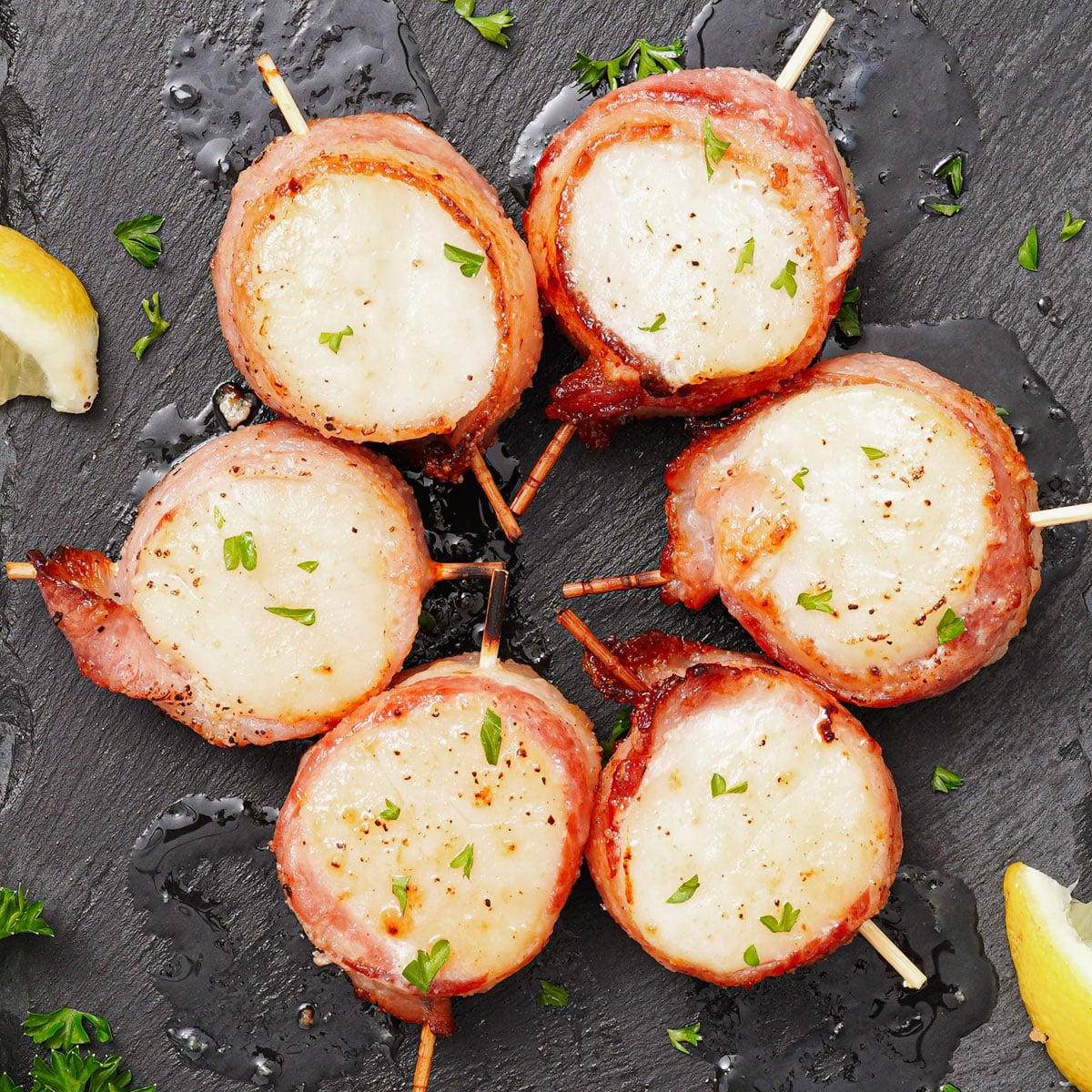Air Fried Bacon Wrapped Scallops served with lemon wedges