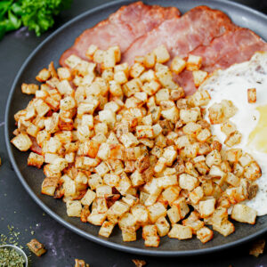 Air fried home fries with turkey bacon and fried egg.