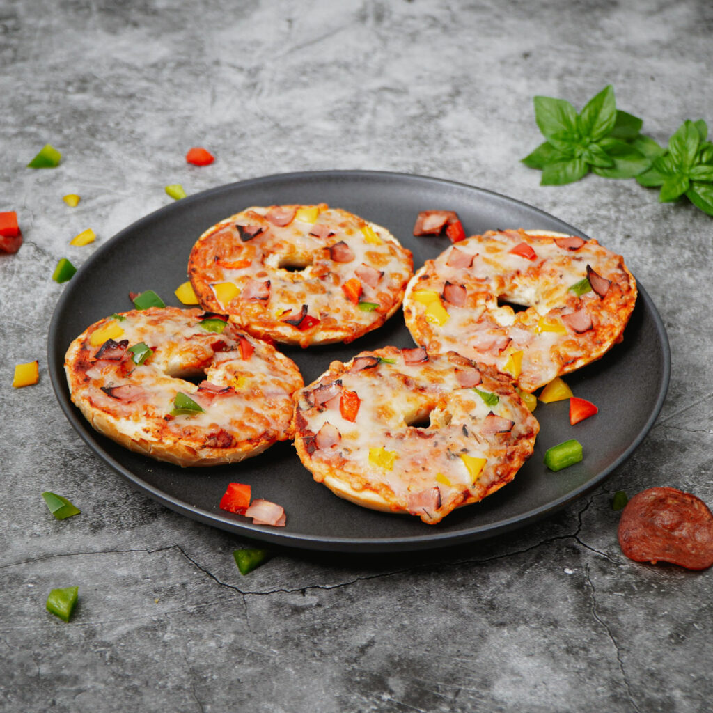 air fryer pizza bagels in a black plate