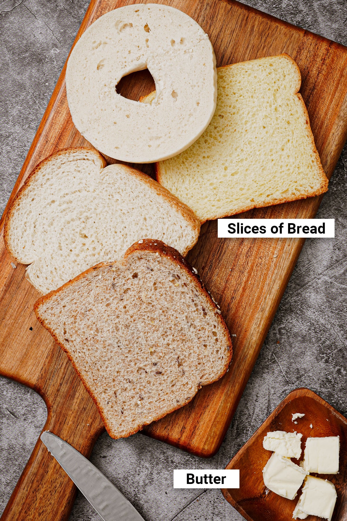 Different types of bread slices: plain bagel, brioche, white, whole wheat.