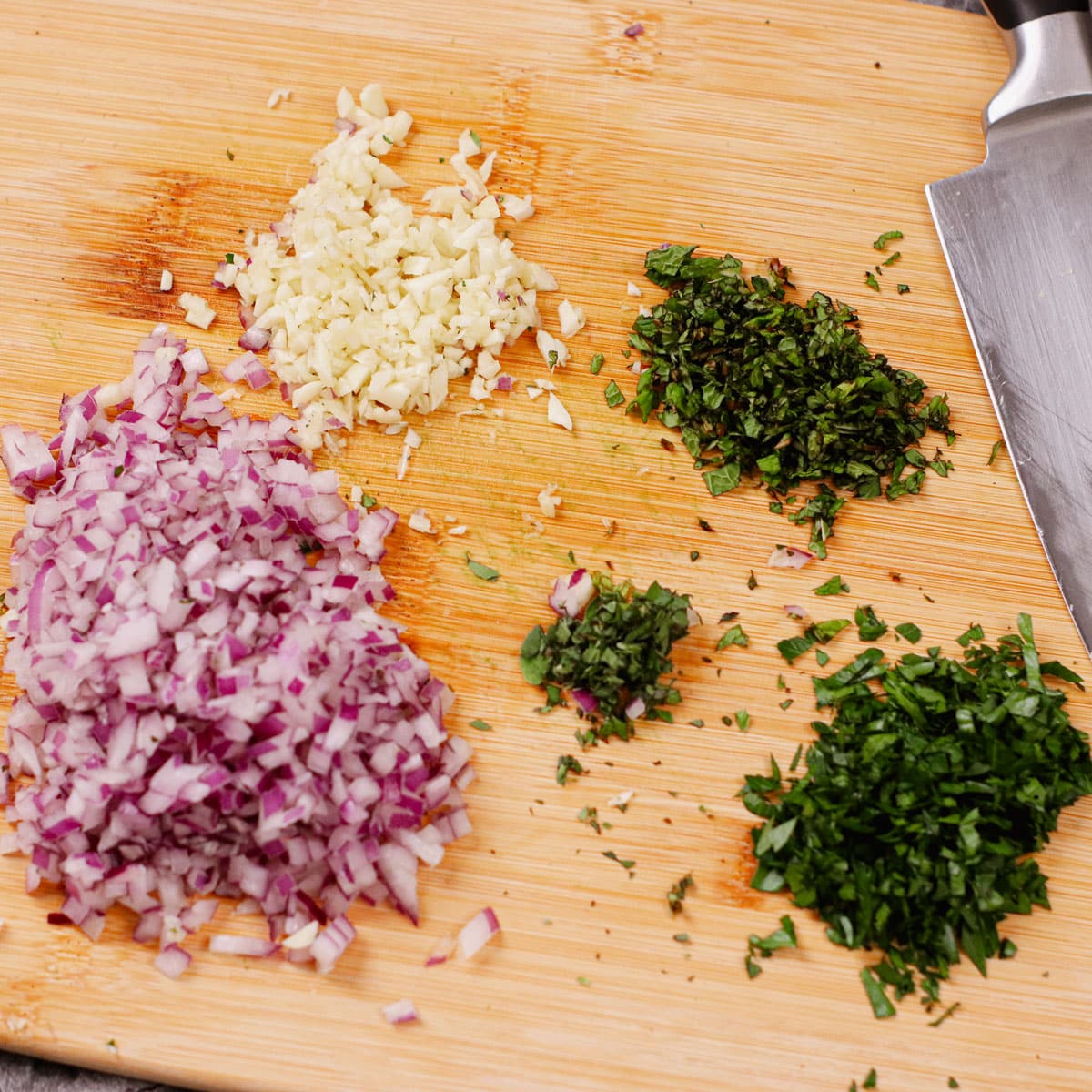 Chopped herbs and spices: onion, garlic, parsley, mint, oregano