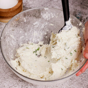 Mixing cream cheese filling for jalapeño popper recipe