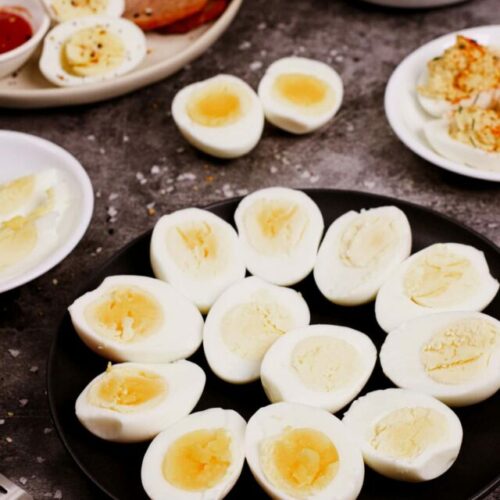 Air fryer hard boiled eggs recipe bite shot with multiple serving options: deviled eggs, salad, breakfast