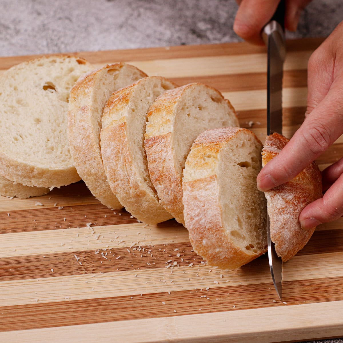 Cutting loaf of bread into 1-inch slices