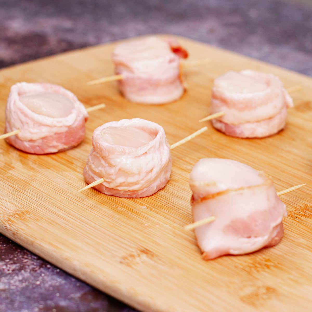 Scallops wrapped with bacon