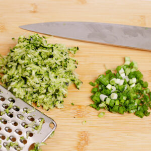 Chopped green onion and grated zucchini