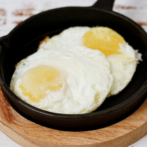 Air fried eggs in a small cast iron skillet