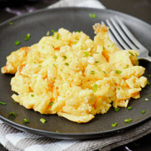 Air fried scrambled eggs garnished with green onion