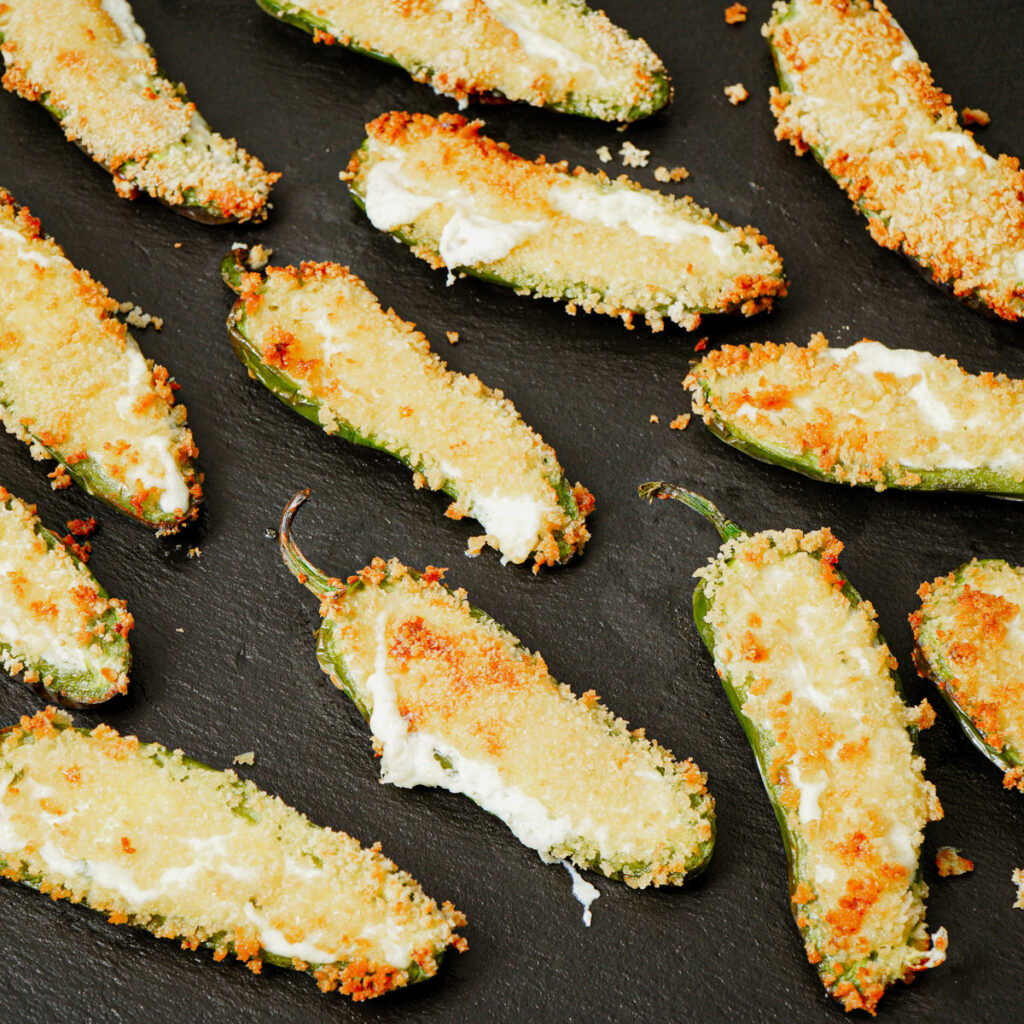 Air fryer jalapeno poppers served in a black slate