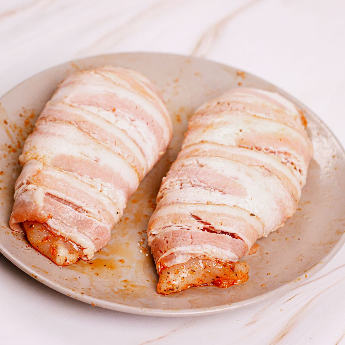 Chicken breast filets wrapped in bacon