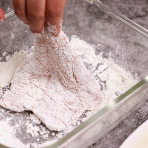 Step 1: Dredge the chicken cutlets in dry batter.