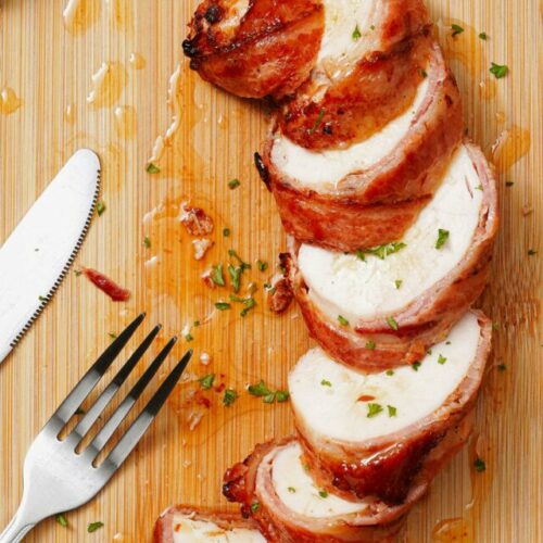 Air fryer bacon wrapped chicken breast recipe bite shot, sliced, top view.