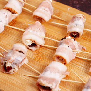 Cream cheese stuffed dates wrapped in bacon with toothpick
